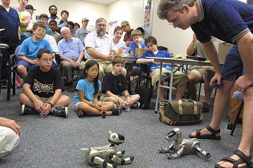 Calvin with two Aibo robot dogs